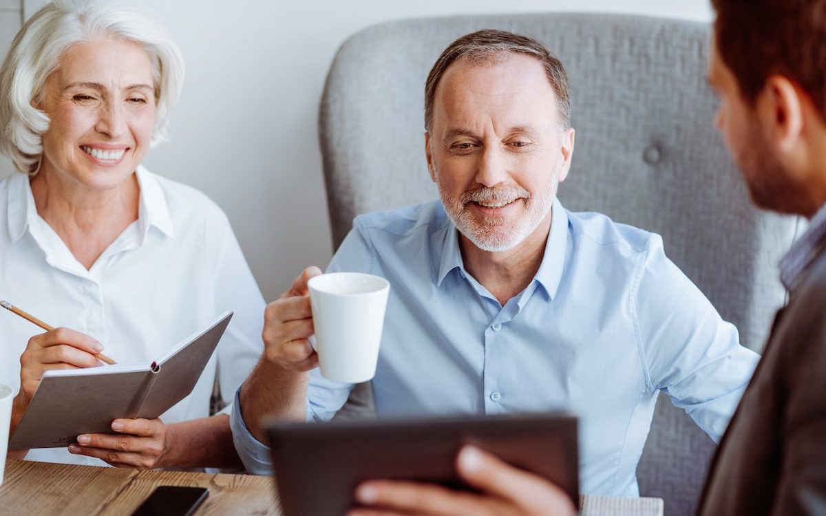 man and woman meeting with real estate agent