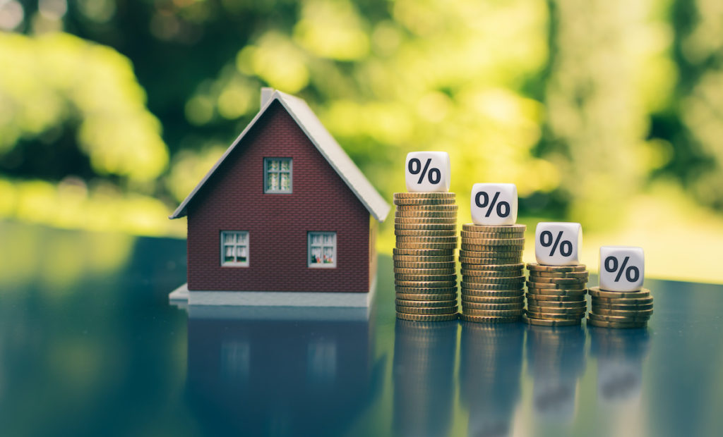 House with coin stacks and percentages