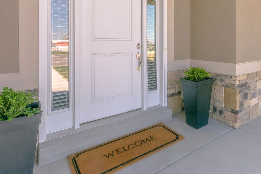 potted plants and welcome mat accents