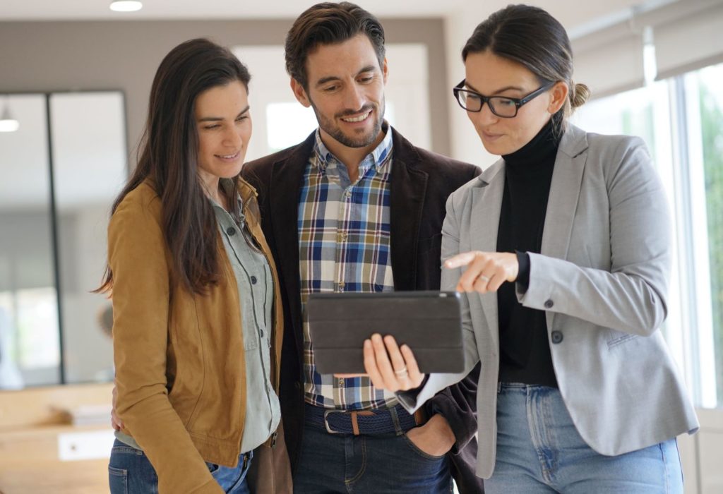 Couple with real estate agent