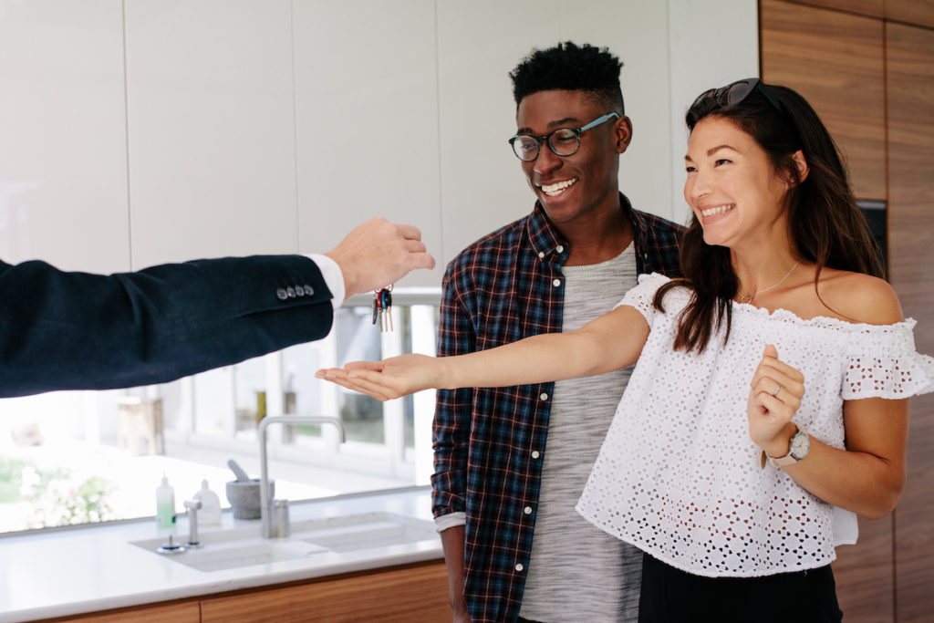 happy buyers receiving keys before back-to-school season