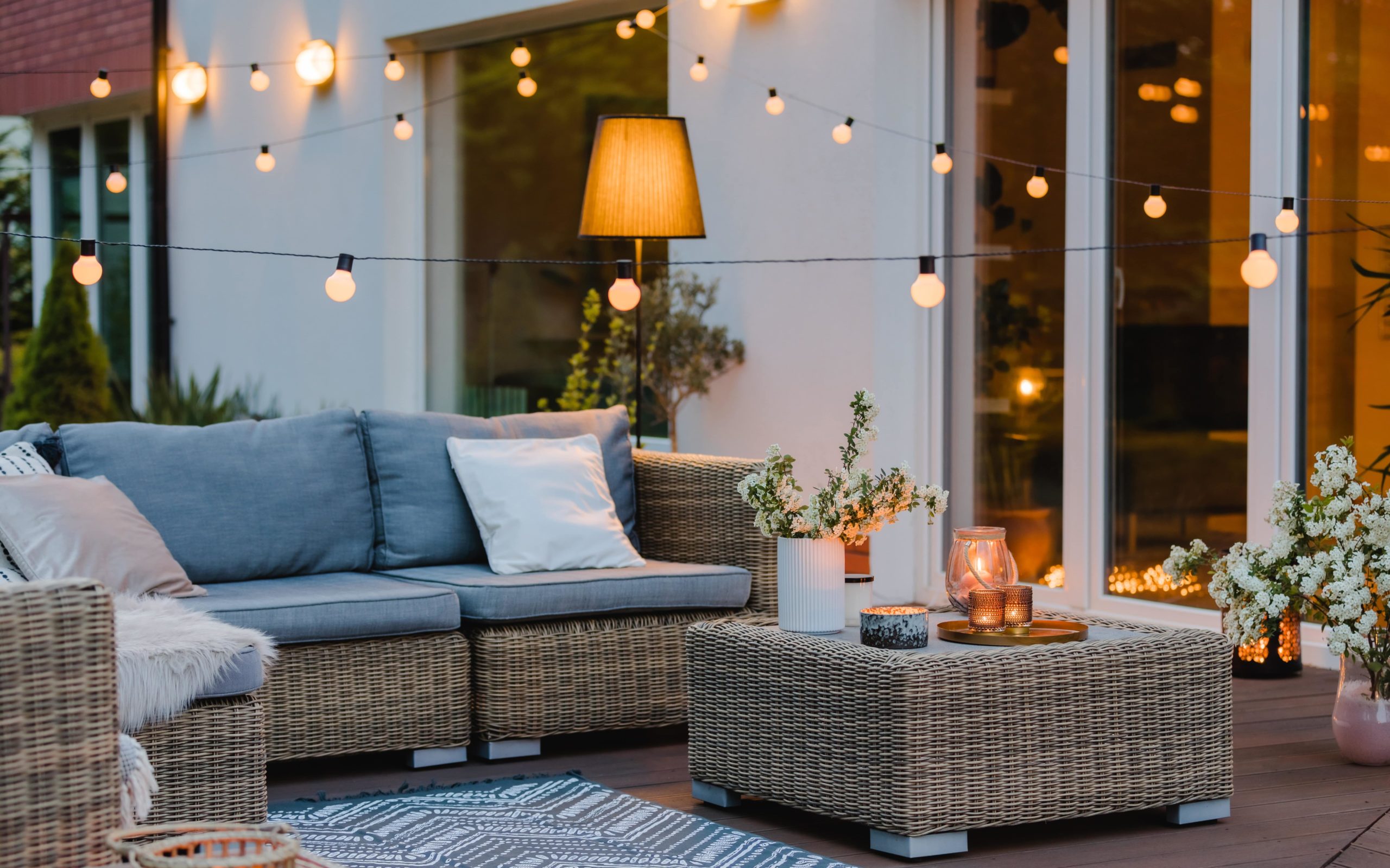 outdoor patio with furniture and string lights
