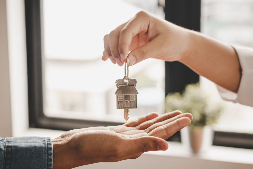 handing house keys over to buyers