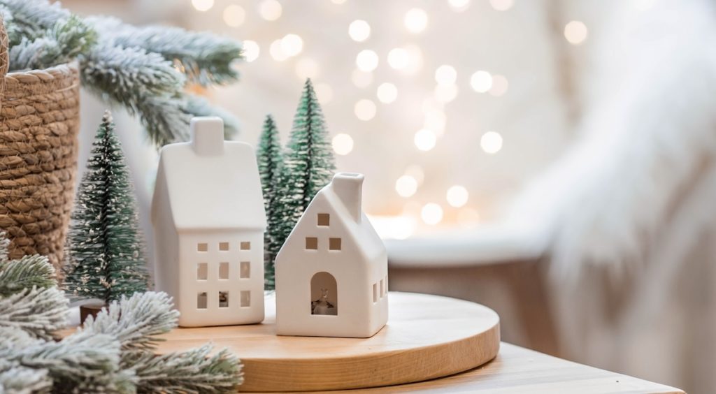 White miniature homes with holiday trees