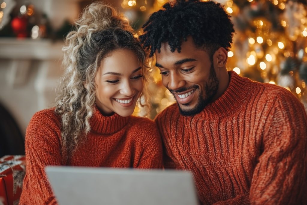 Couple on laptop exploring the holiday real estate market