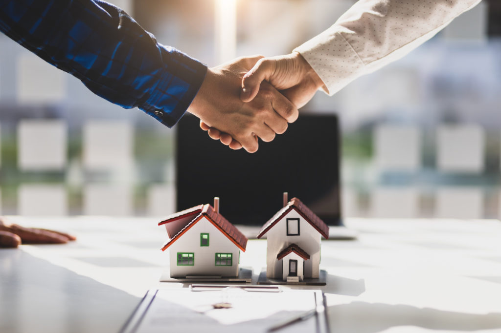 real estate negotiation, shaking hands